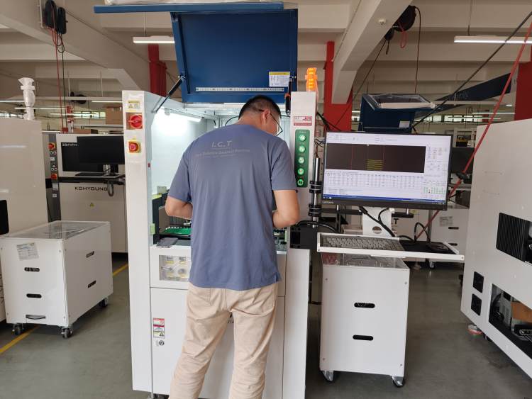 I.C.T Engineer Completes Pre-Shipment Testing for Conformal Coating Machine.jpg