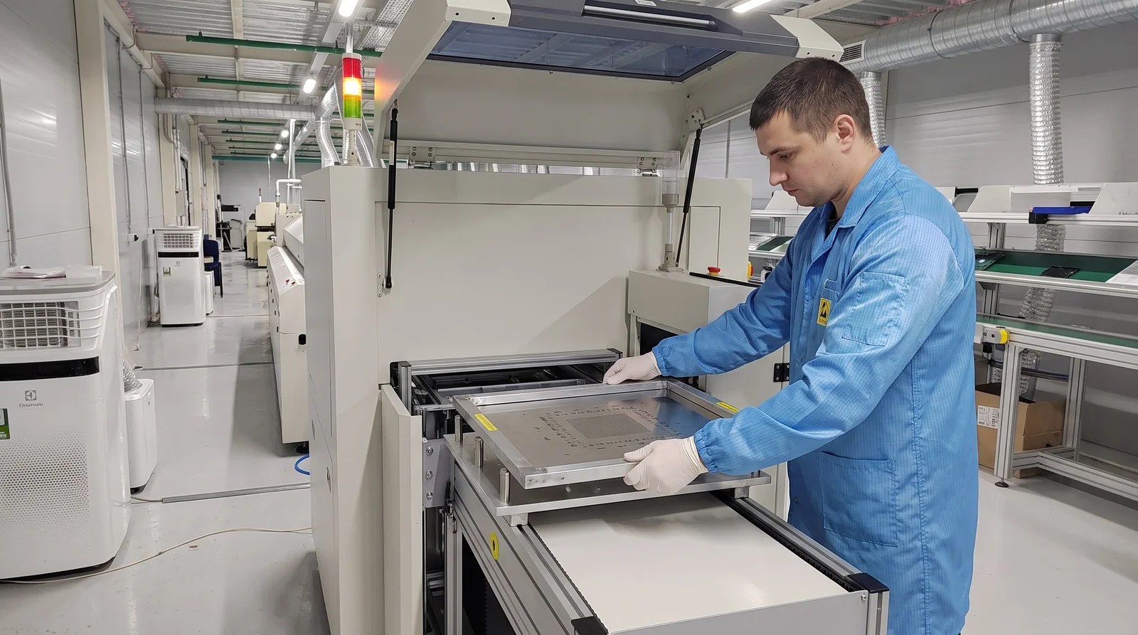 Inspector checking printed solder paste deposit